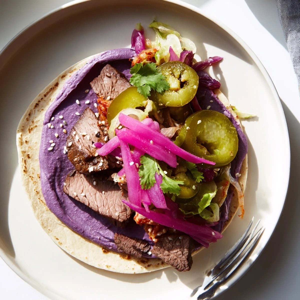 Deliciously spiced Fusion Tacos featuring marinated beef, kimchi, and fresh herbs.  