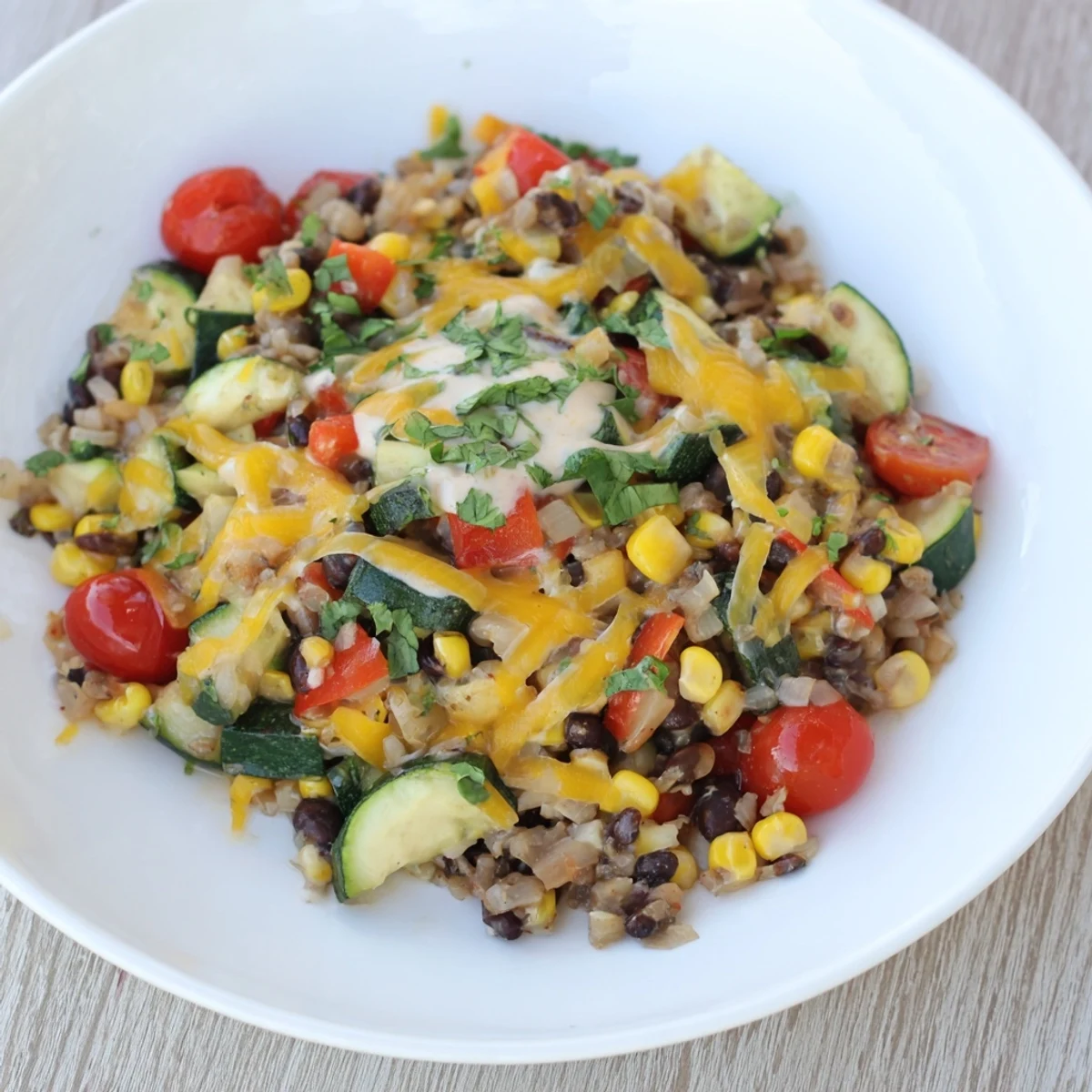 A flavorful Veggie-Packed Taco Skillet, offering a symphony of textures, from soft beans to fresh avocado yogurt.