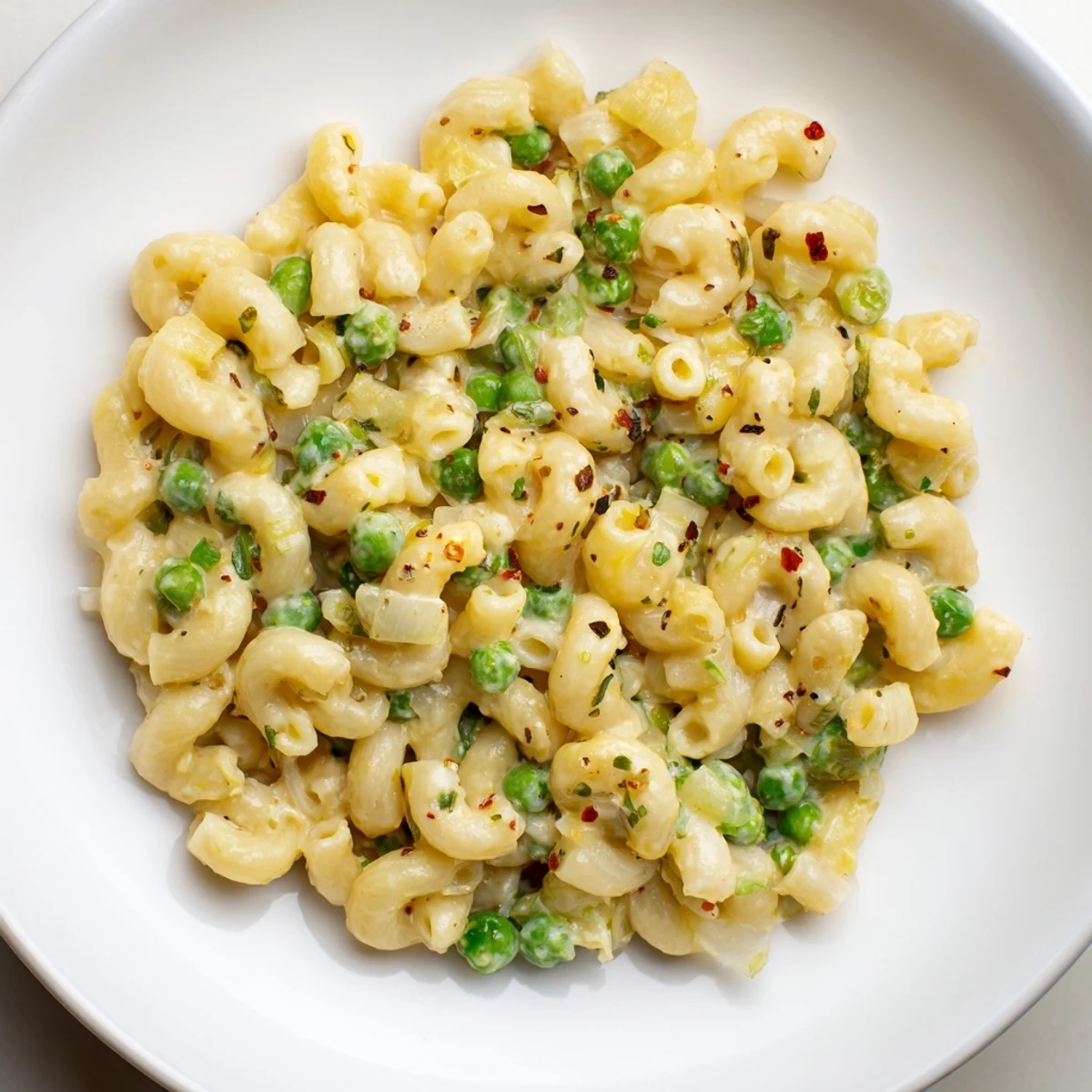 A close-up shot of hot, delicious Macaroni & Peas, perfect for a quick, family-friendly dinner.