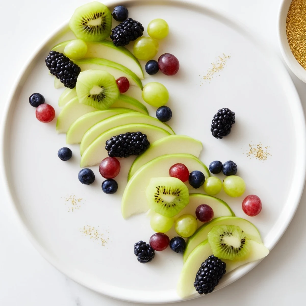 A colorful Aurora Borealis Sweep, a stunning fruit platter with green and purple fruits arranged beautifully.