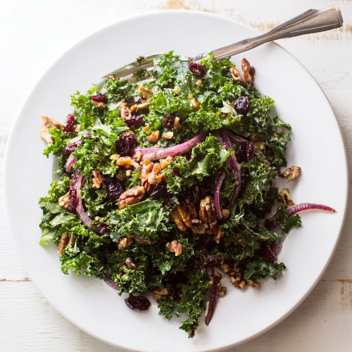 Vibrant massaged kale salad featuring a sweet maple mustard dressing.