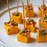 Bright appetizer photo: festive cheese and pretzel sparklers ready for your New Year's Eve party feast.