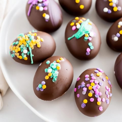 Decorated Easter egg candy, a colorful display of homemade treats dusted in sprinkles.
