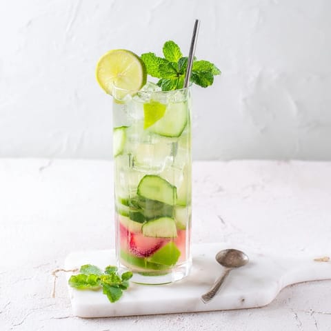 Vibrant mocktails featuring strawberry syrup and mint, perfect for summer gatherings.  