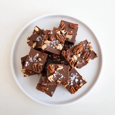 This easy-to-make Easy Marshmallow Fudge shows a pan of chocolatey squares with tiny marshmallow bits.