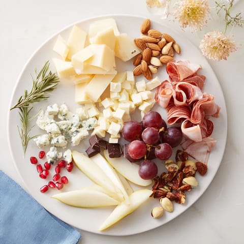 A close-up of the Winter Wonderland Grazing Tray, festively arranged meats, cheeses, and colorful snacks.