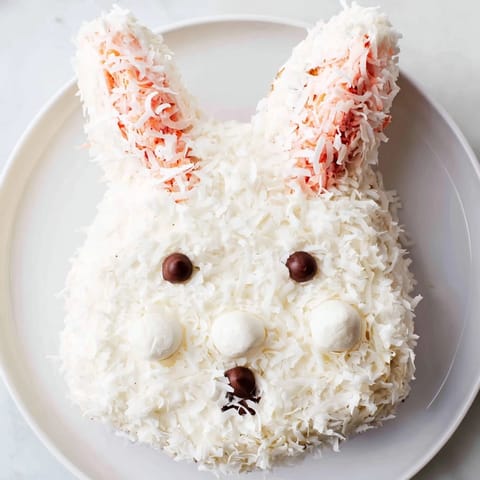 Deliciously moist Spring Bunny Carrot Cake, frosted with cream cheese, adorned to form a bunny.