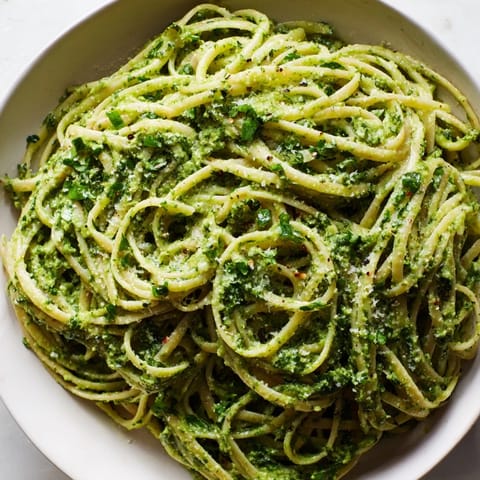 A bowl of green goddess pasta sauce with linguine – a flavorful, herby vegetarian dinner option.