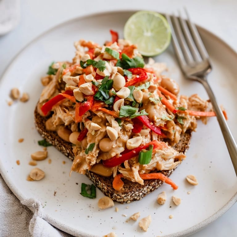 Imagine crunchy, saucy Thai Peanut Pinto Chicken Toast, topped with fresh cilantro.